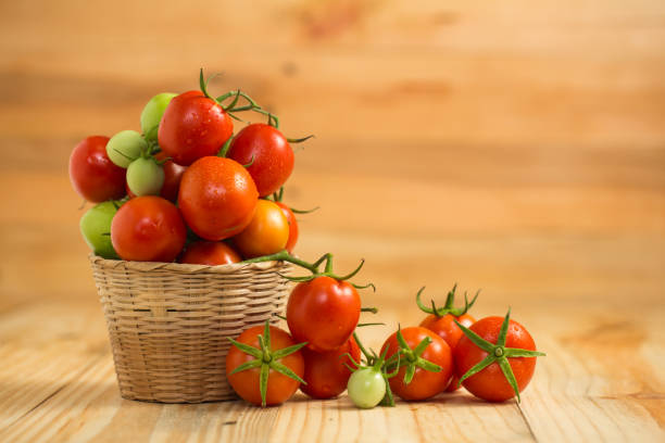 istock fresh tomato  on  wooden background 653881370