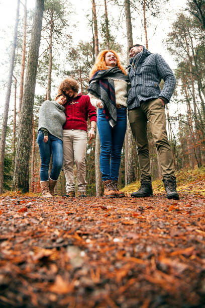 istock Two couple walking into wood 653887170