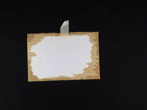 istock Corrugated cardboard piece on black background. 653887548