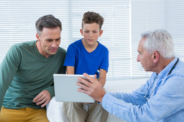istock Doctor and patient discussing over digital tablet 653888782