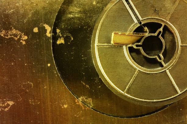 istock Old film reel on a scratched and rusty metal background. 653888972