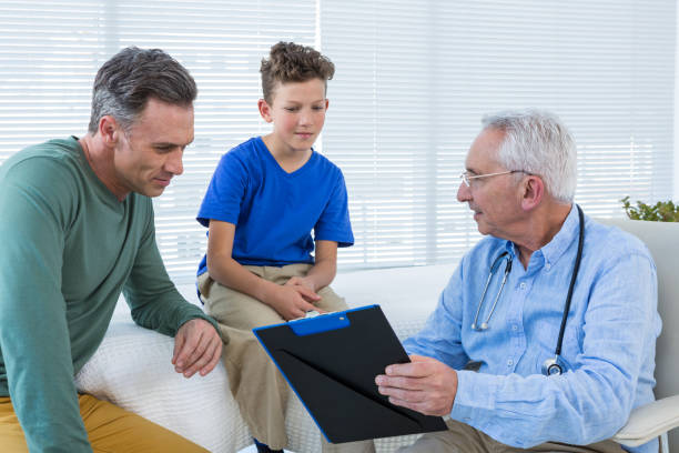 istock Doctor discussing reports with patient and his guardian 653889614