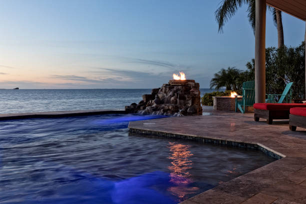 istock Beautiful Evening by the Swimming Pool in Tropical Setting 653890346