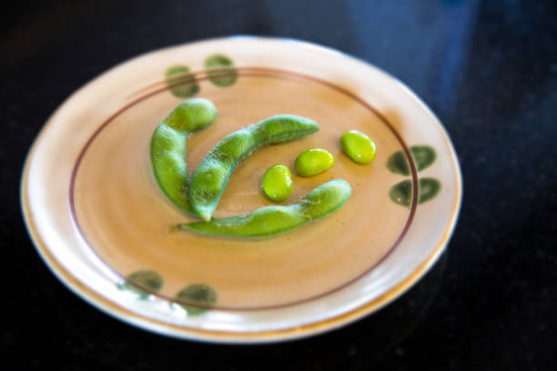 istock Sugar Pea on a white plate and dark background. 653890410