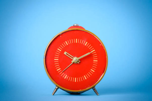 istock Vintage clock on wooden table 653891314