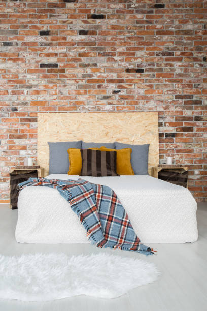 istock Industrial style bedroom with bed 653892464