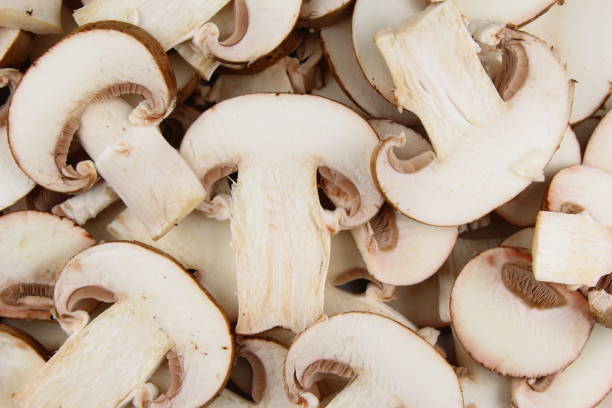 istock fresh mushroom slices food background texture 653893796