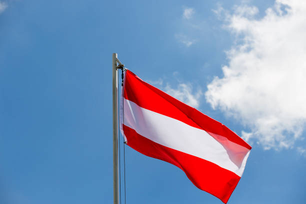 istock National flag of Austria on a flagpole 653897826