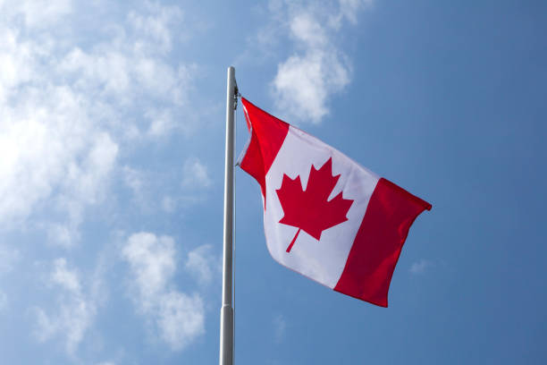 istock National flag of Canada on a flagpole 653898688