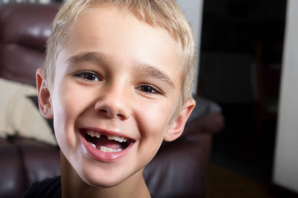 istock Cute and funny young boy with funny face 653900072