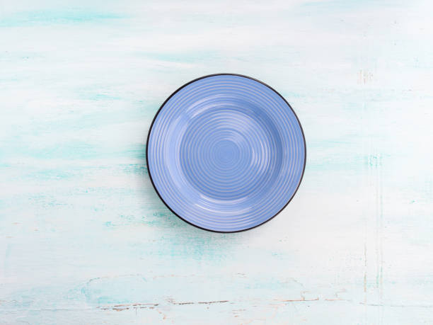 istock Pastel Color ceramic plate dish top view background 653901178
