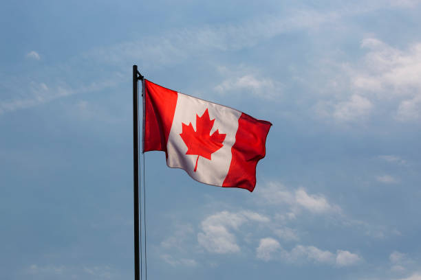 istock National flag of Canada on a flagpole 653902740
