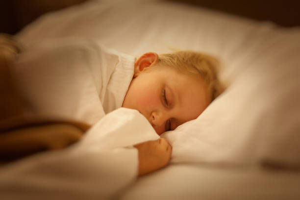 istock Girl sleeping in the bed 653908668
