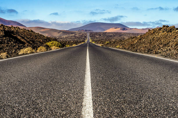 istock road timanfaya volcano lanzarote long 653913120