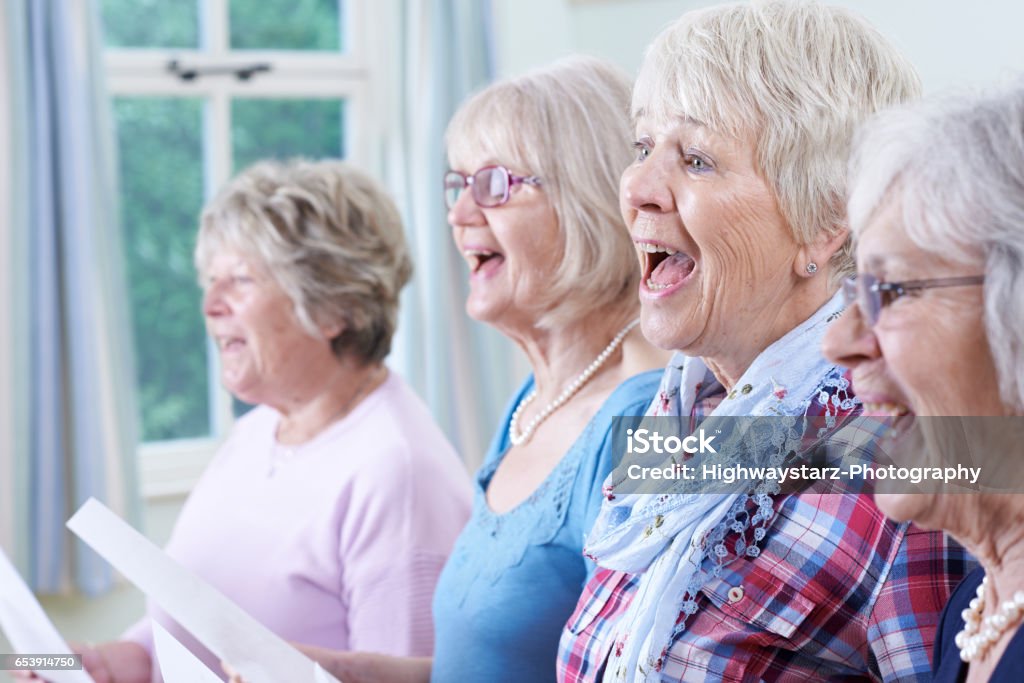 Group Of Senior Women Singing In Choir Together Singing Stock Photo