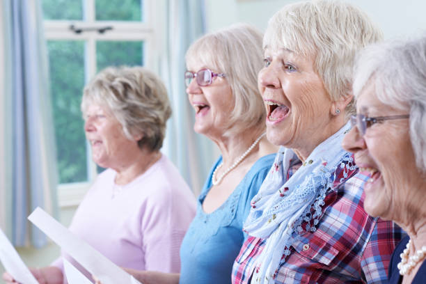 Group Of Senior Women Singing In Choir Together Group Of Senior Women Singing In Choir Together happiness four people cheerful senior adult stock pictures, royalty-free photos & images