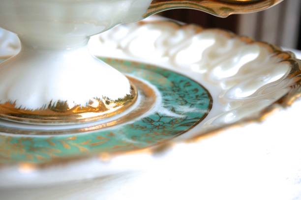 istock Green and Gold Old Fashioned Tea Cup and Saucer 653921658