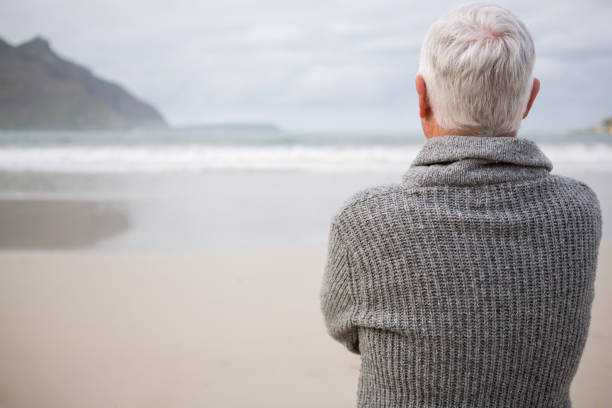 istock Rear view of senior man with hands crossed 653922004