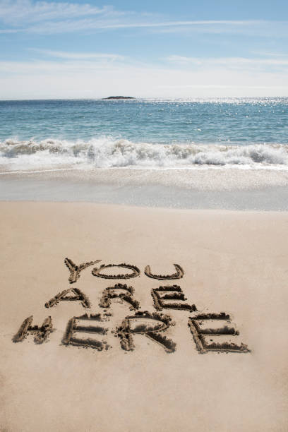 istock Beach Vacation and You Are Here 653924682