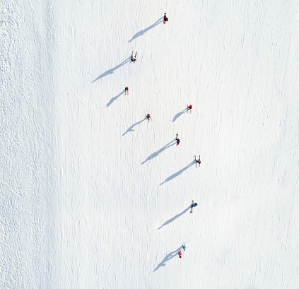 Aerial view of skiers going down the mountain