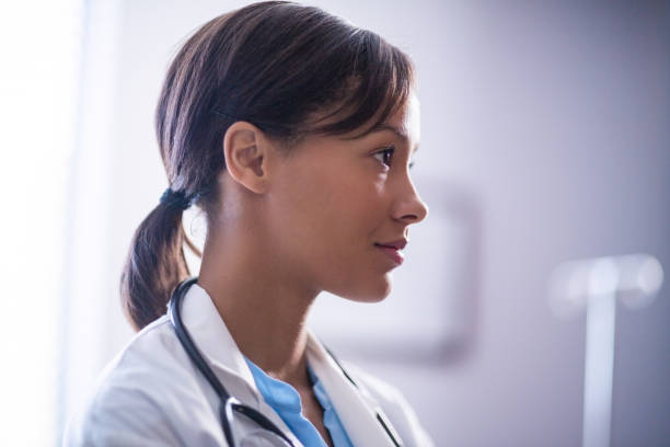 istock Thoughtful female doctor with stethoscope in ward 653927840