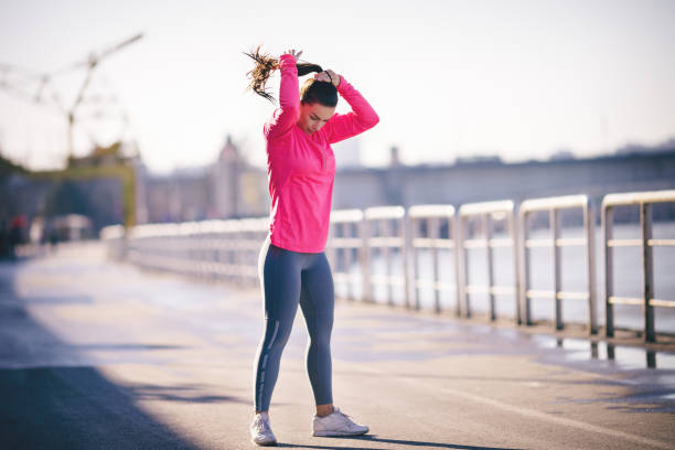 istock Beautiful young woman getting ready to exercise 653929530