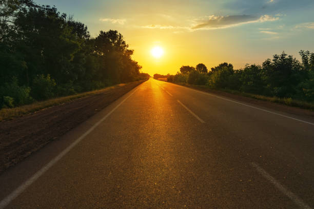 istock road to horizon in sunset 653929558