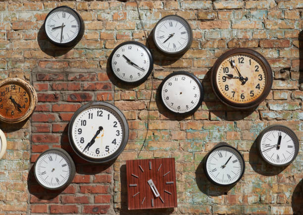 istock Old broken house wall, and street clock on a brick wall 653929816
