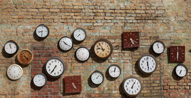 istock Old broken house wall, and street clock on a brick wall 653929840