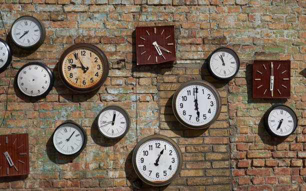 istock Old broken house wall, and street clock on a brick wall 653929848