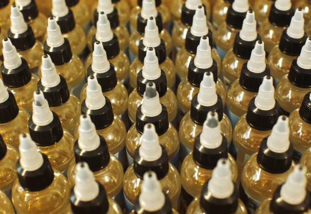 istock Many plastic bottles with caps with liquid for electronic cigarettes top view close up 653930144