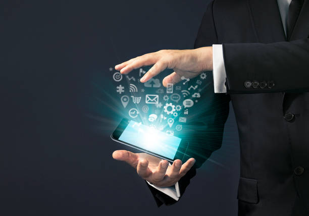 istock Businessman magical touch concept -  multimedia smart phone 653930462