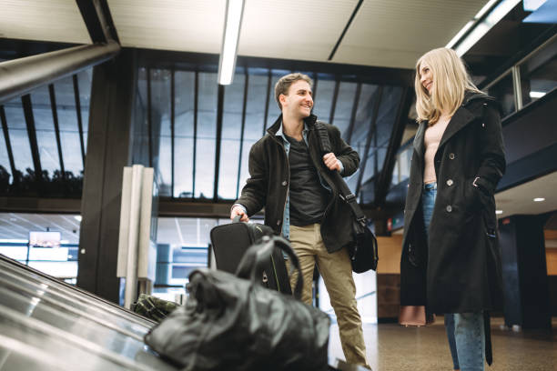 istock Couple At Airport Baggage Pick-Up 653930662