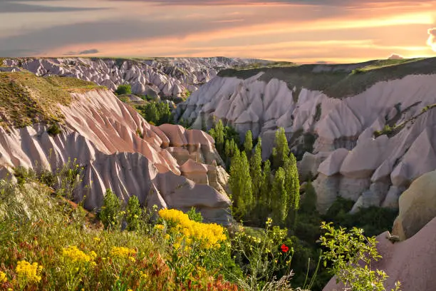 Sunrise over valley with volcanic ash shapes, Cappadocia, Turkey.