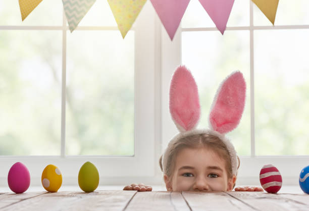 istock girl wearing bunny ears 653933932