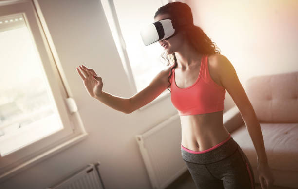 istock Exercising at home with VR glasses is future 653934686