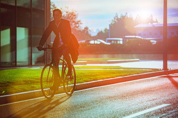 istock Handsome man riding bicycle in an urban environment 653935020