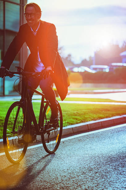 istock Handsome man riding bicycle in an urban environment 653936422