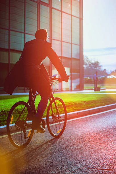 istock Handsome man riding bicycle in an urban environment 653938740