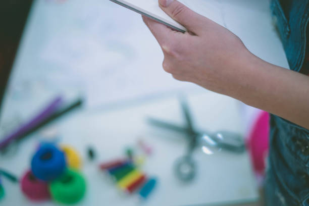 istock Seamstress woman preparing material 653939330