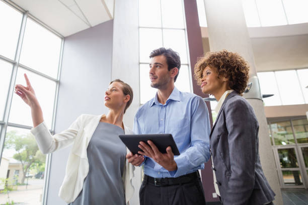 istock Business executives discussing over digital tablet 653941000