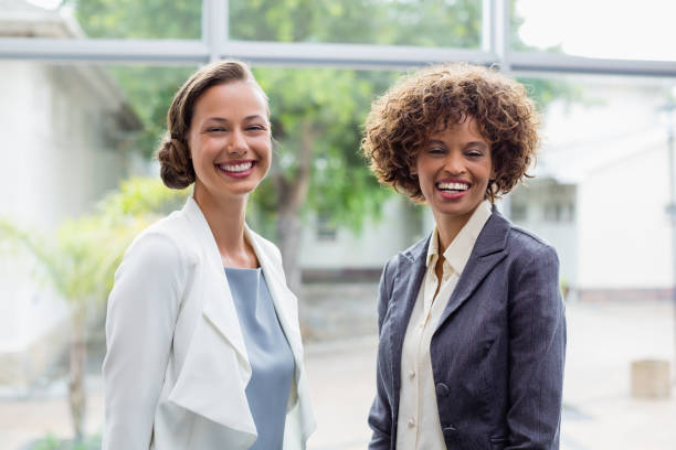 istock Cheerful business executives at conference centre 653941160