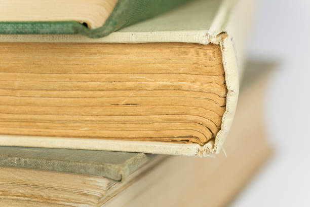 istock Stacked old bound and yellowed books 653941290