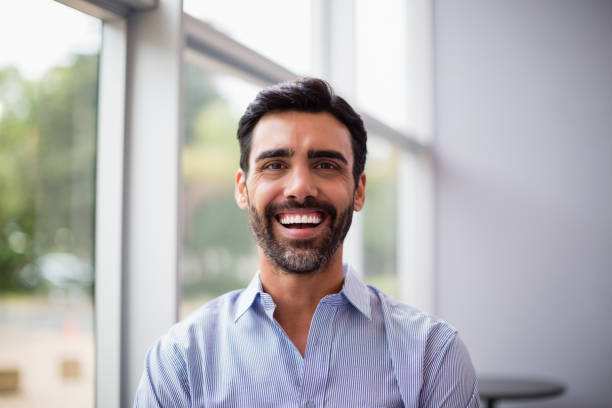 istock Cheerful businessman at conference centre 653941790