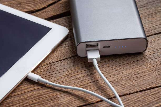 istock Smartphone charging with power bank. 653942168