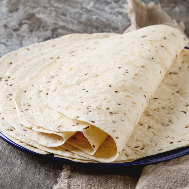 istock Tartilla sheets on a gray background. Brown cloth. Mexican food. 653945568