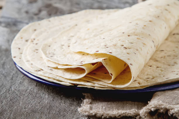 istock Tartilla sheets on a gray background. Brown cloth. Mexican food. 653945578