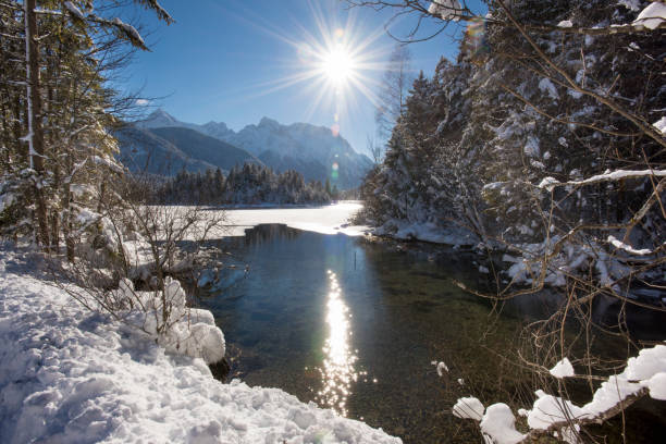 istock panorama scene at winter in Bavaria with ice and snow 653945948