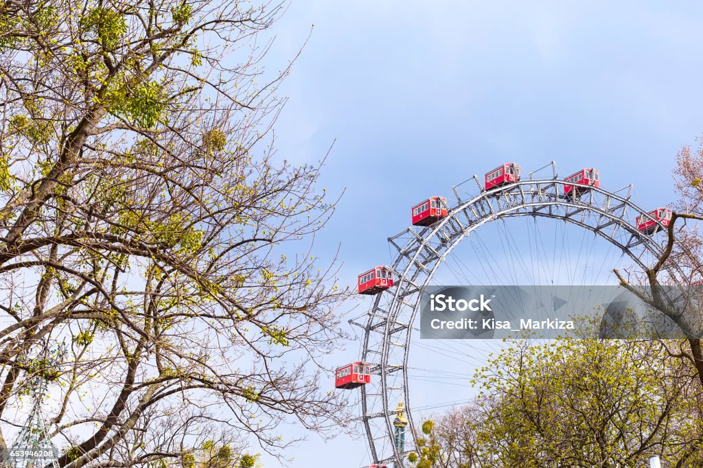 Prater Wheel, Vienna, Austria among spring green trees Prater Ferris Wheel, icon of Vienna, Austria among spring green trees Adult Stock Photo