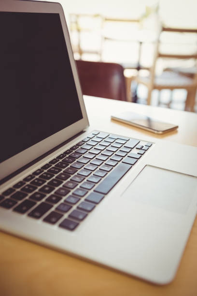 istock Close-up of laptop and mobile phone on a table 653949700